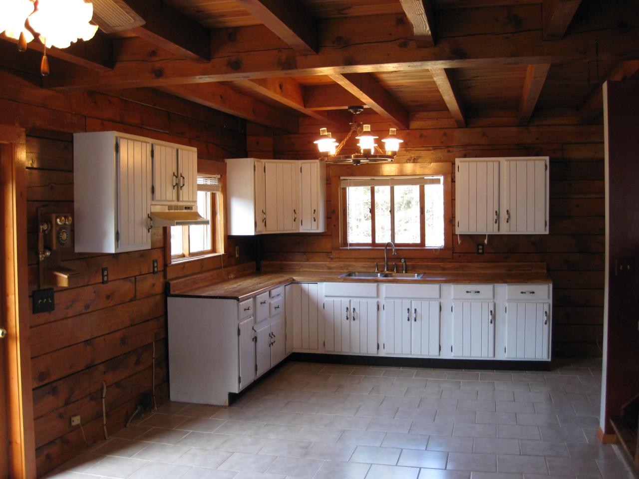 58 Bromley Road Chester, MA 01050 - Photo 3 of 12 a large kitchen with granite countertop wooden cabinets a sink and dishwasher