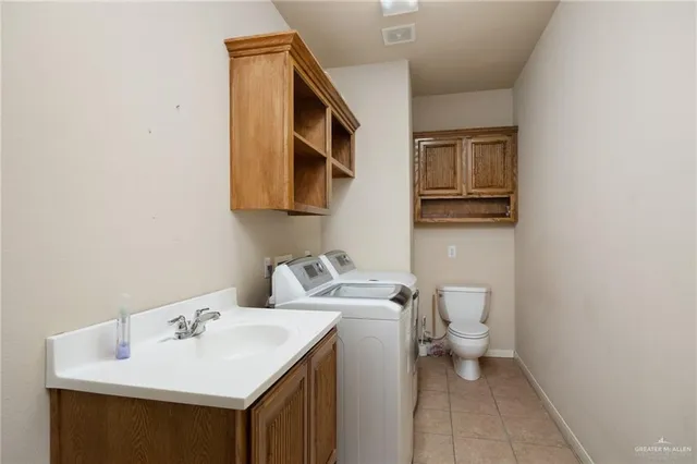 a bathroom with a sink toilet and mirror