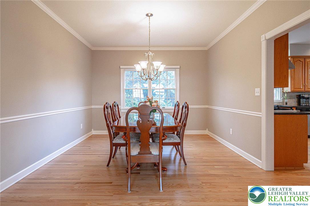 6551 Overlook Road Orefield, PA 18069 - Photo 18 of 82 a view of a dining room with furniture window and wooden floor
