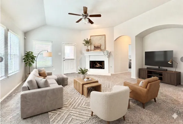 a living room with furniture and a flat screen tv
