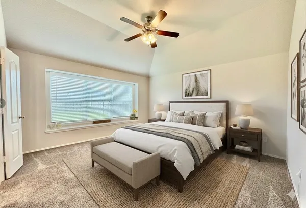 a spacious bedroom with a bed and a large window
