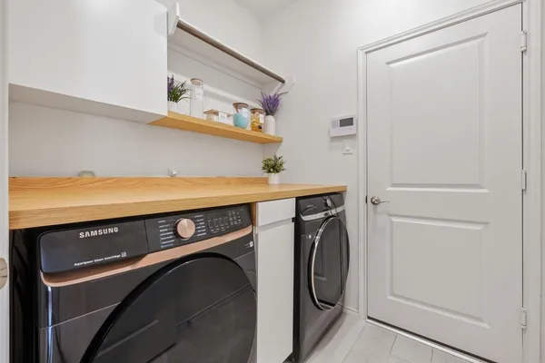 a utility room with dryer and washer