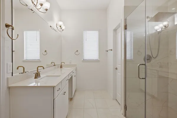 a bathroom with a sink double vanity and a mirror