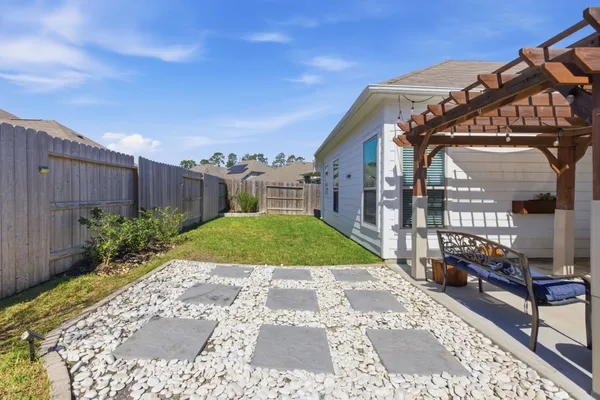 a view of a back yard of the house