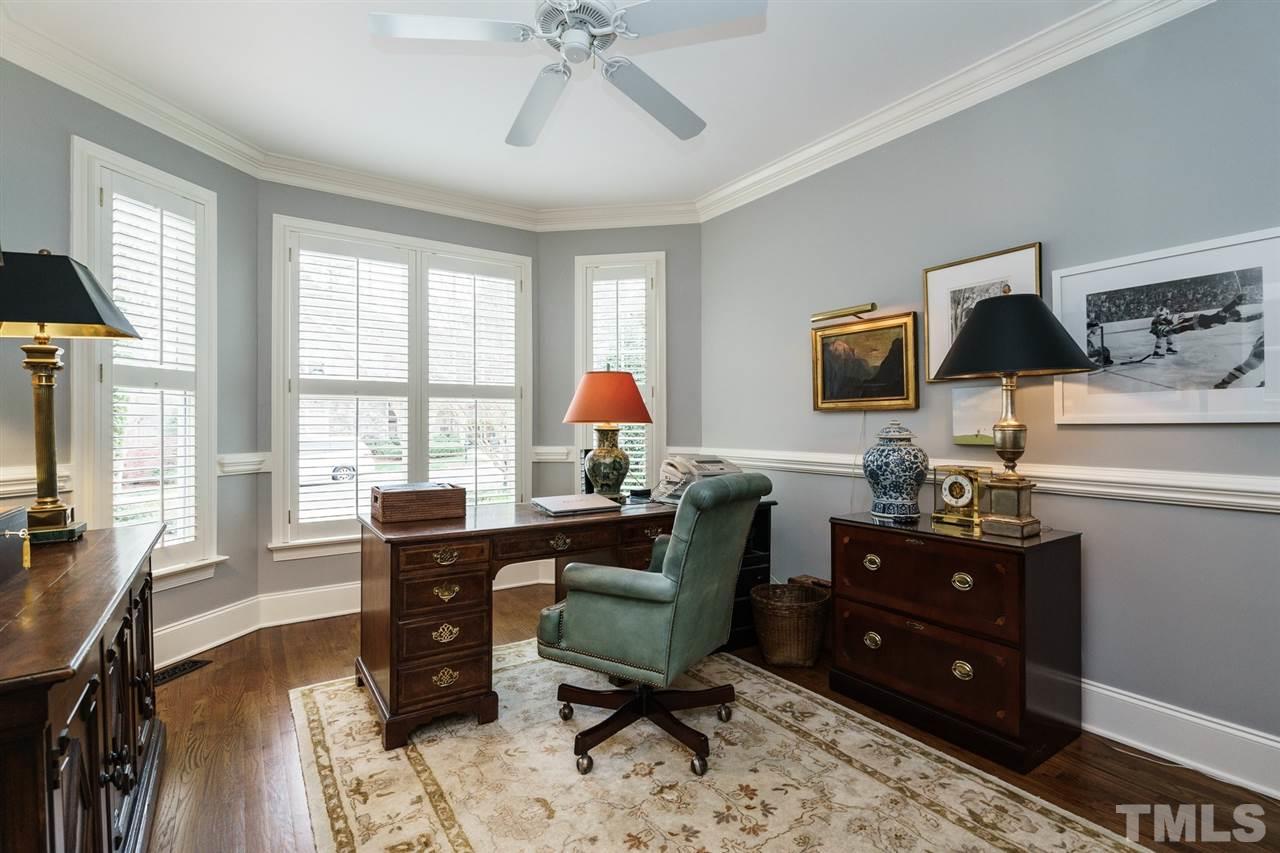 1820 Torrington Street Raleigh, NC 27615 - Photo 13 of 25 a view of a workspace with furniture and a window