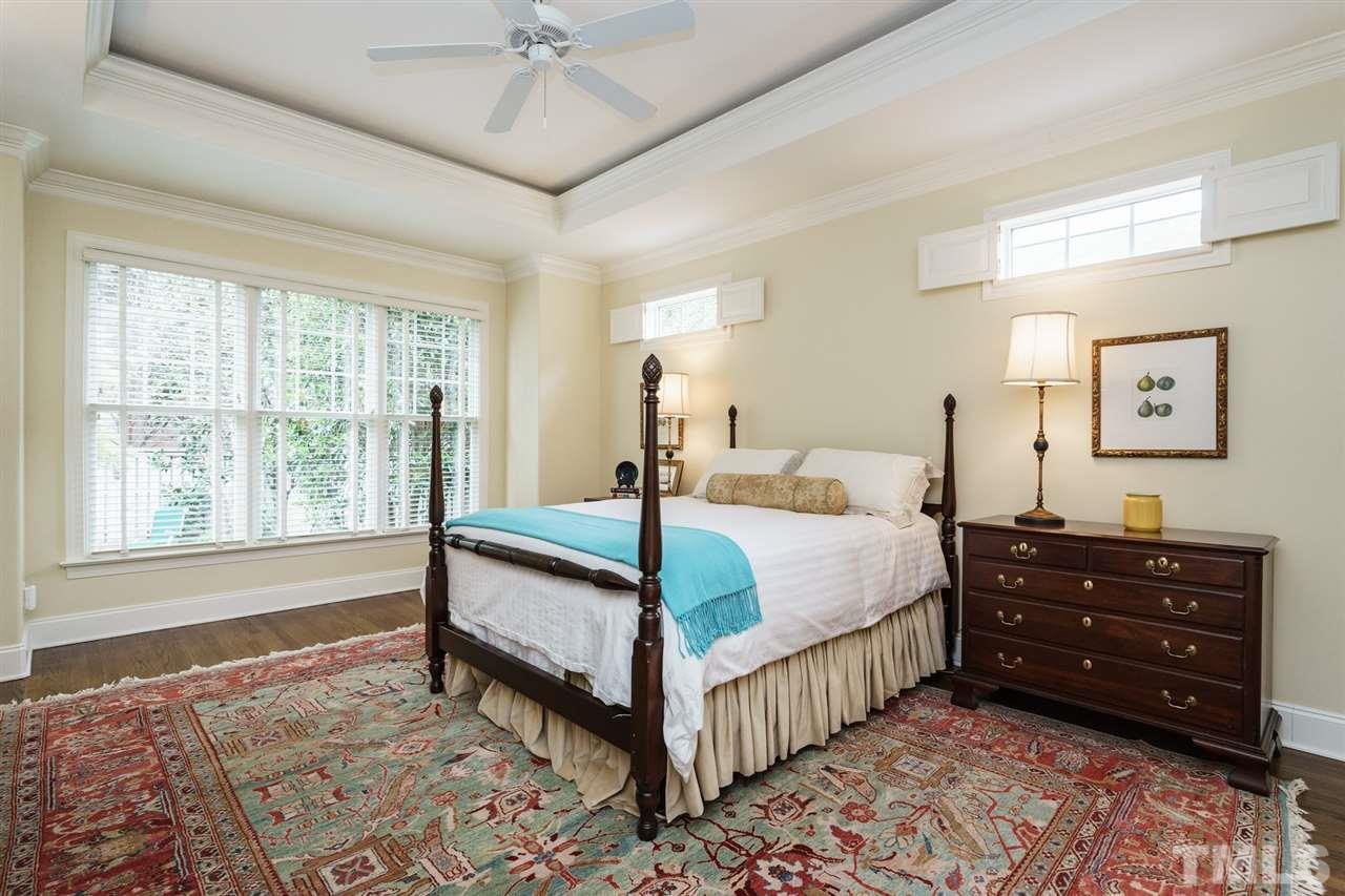 1820 Torrington Street Raleigh, NC 27615 - Photo 14 of 25 a bed room with a bed and a window