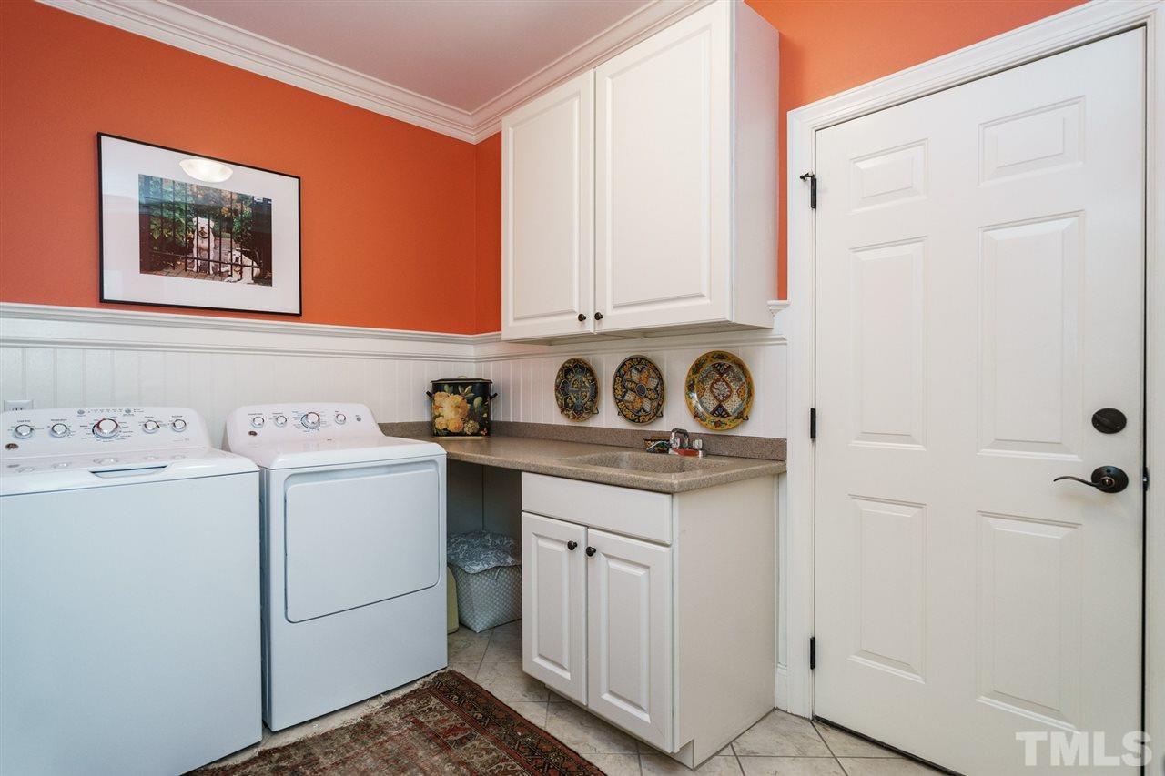 1820 Torrington Street Raleigh, NC 27615 - Photo 16 of 25 a utility room with dryer and washer