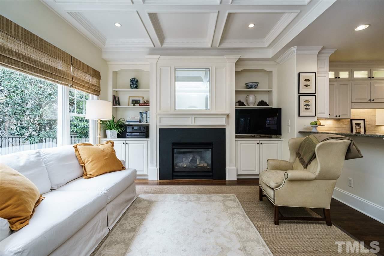 1820 Torrington Street Raleigh, NC 27615 - Photo 17 of 25 a living room with furniture and a fireplace