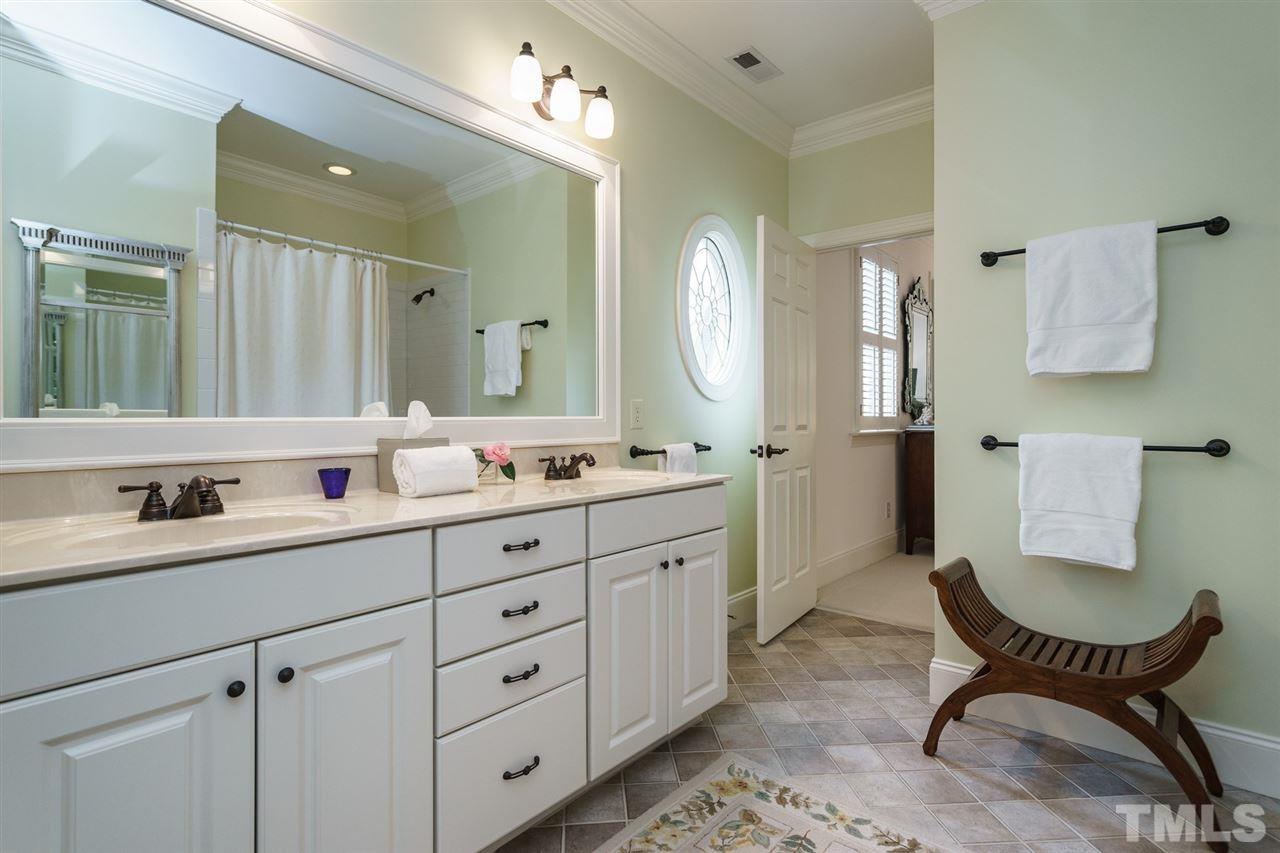 1820 Torrington Street Raleigh, NC 27615 - Photo 22 of 25 a spacious bathroom with a double vanity sink mirror and