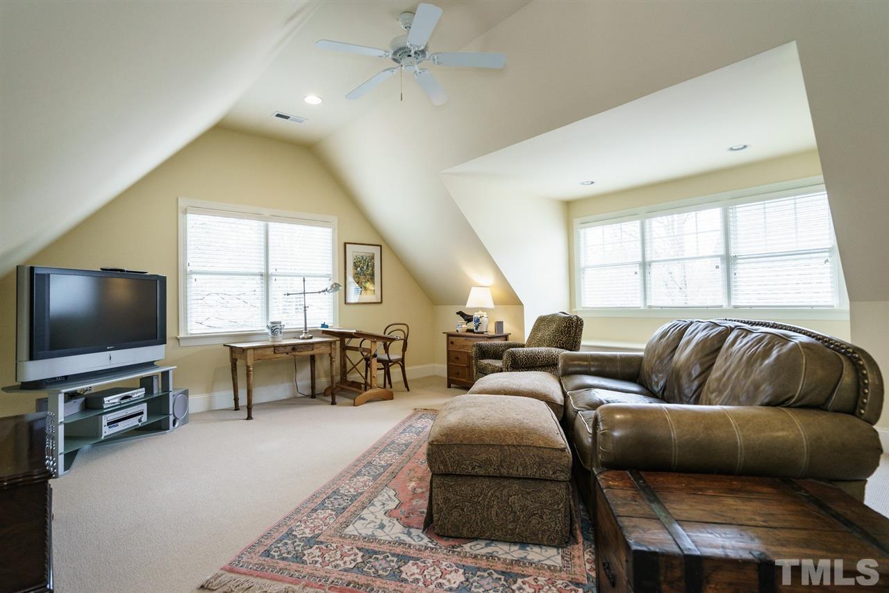 1820 Torrington Street Raleigh, NC 27615 - Photo 23 of 25 a living room with furniture and a flat screen tv