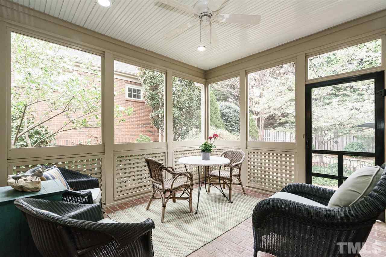 1820 Torrington Street Raleigh, NC 27615 - Photo 24 of 25 a living room with furniture and a floor to ceiling window