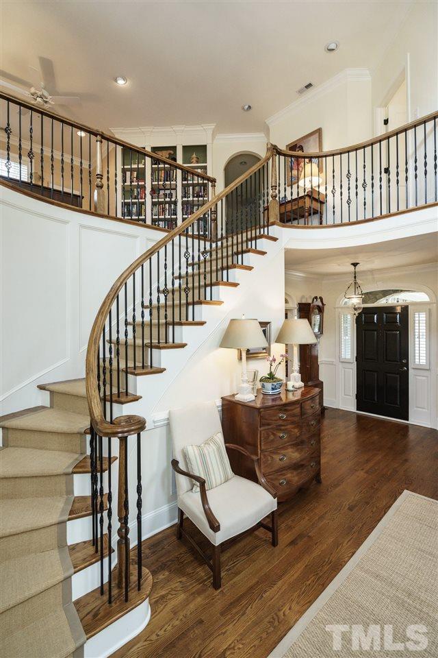 1820 Torrington Street Raleigh, NC 27615 - Photo 5 of 25 a living room with fireplace furniture and a wooden floor