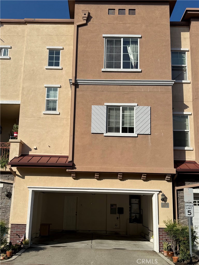 13645 Foster Avenue, Unit 4 Baldwin Park, CA 91706 - Photo 16 of 19 a view of house with front door