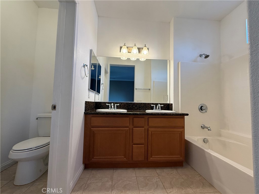 13645 Foster Avenue, Unit 4 Baldwin Park, CA 91706 - Photo 10 of 19 a bathroom with a sink and a mirror