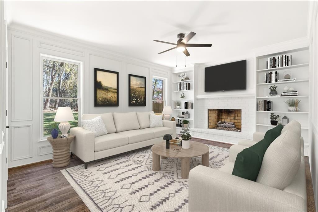 11125 Linbrook Lane Duluth, GA 30097 - Photo 13 of 51 a living room with furniture a fireplace and a flat screen tv