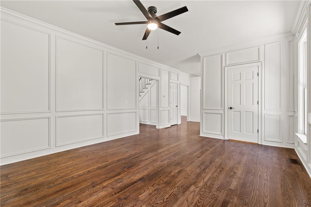 11125 Linbrook Lane Duluth, GA 30097 - Photo 16 of 51 a view of empty room with wooden floor and fan