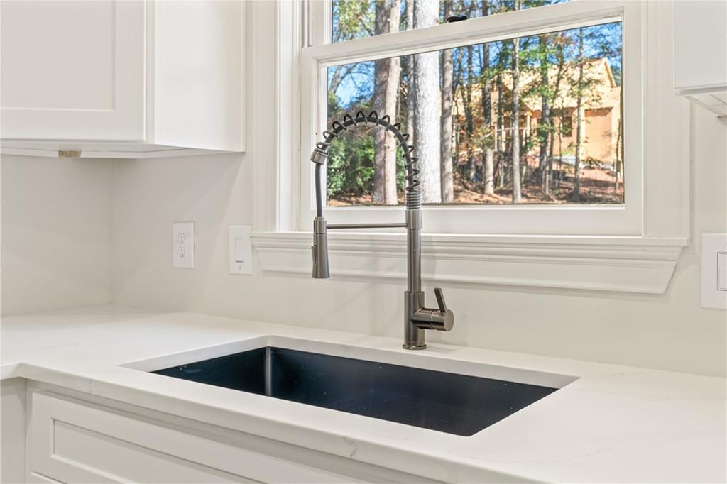 11125 Linbrook Lane Duluth, GA 30097 - Photo 25 of 51 a kitchen with a sink and large window