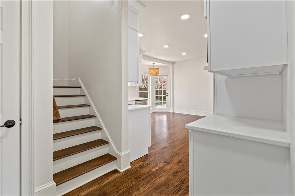 11125 Linbrook Lane Duluth, GA 30097 - Photo 26 of 51 a view of a hallway with wooden floor and stairs