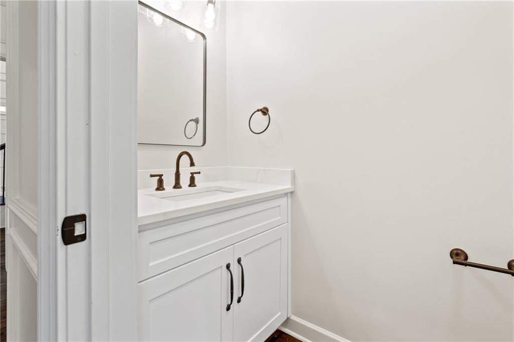 11125 Linbrook Lane Duluth, GA 30097 - Photo 27 of 51 a bathroom with a sink and mirror
