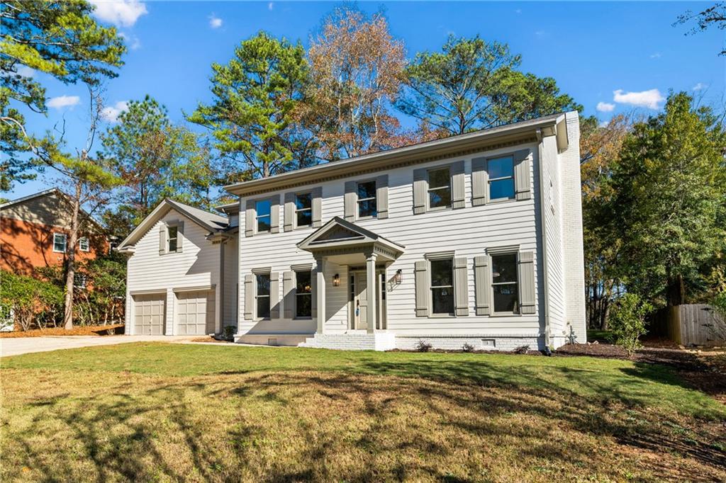 11125 Linbrook Lane Duluth, GA 30097 - Photo 3 of 51 a front view of a house with a yard