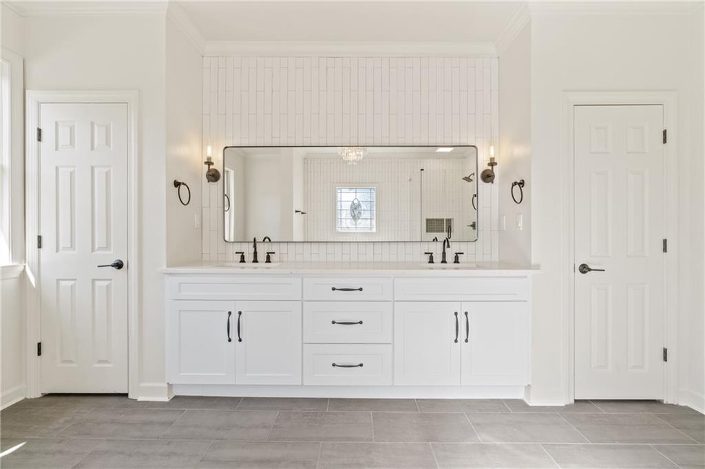 11125 Linbrook Lane Duluth, GA 30097 - Photo 35 of 51 a bathroom with a sink vanity and mirror
