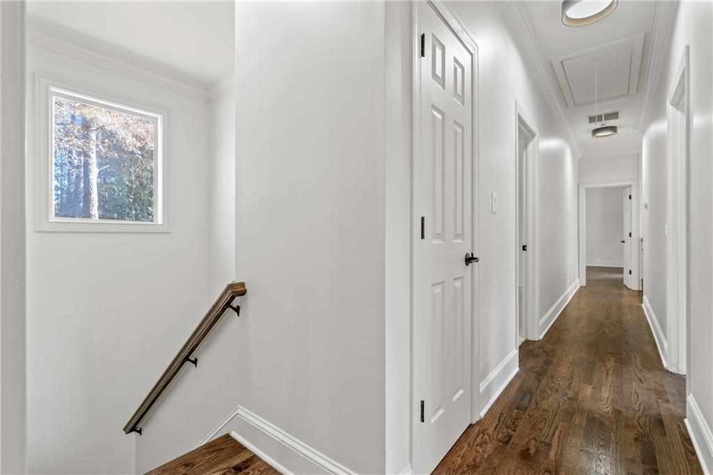 11125 Linbrook Lane Duluth, GA 30097 - Photo 43 of 51 a view of a hallway with wooden floor and staircase