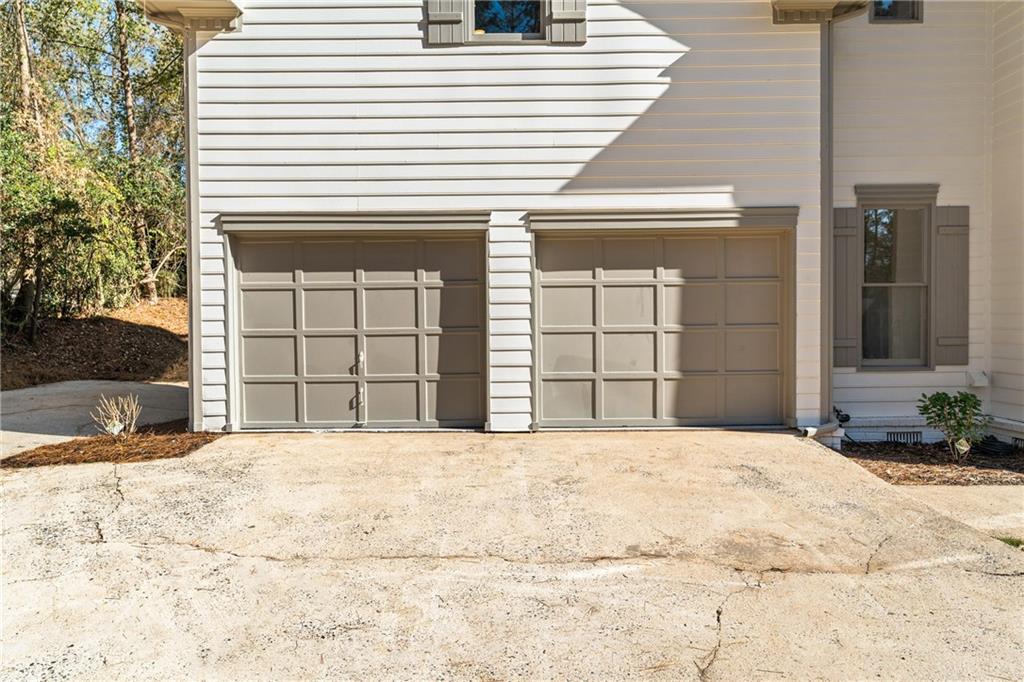 11125 Linbrook Lane Duluth, GA 30097 - Photo 5 of 51 a view of a white house with a outdoor space