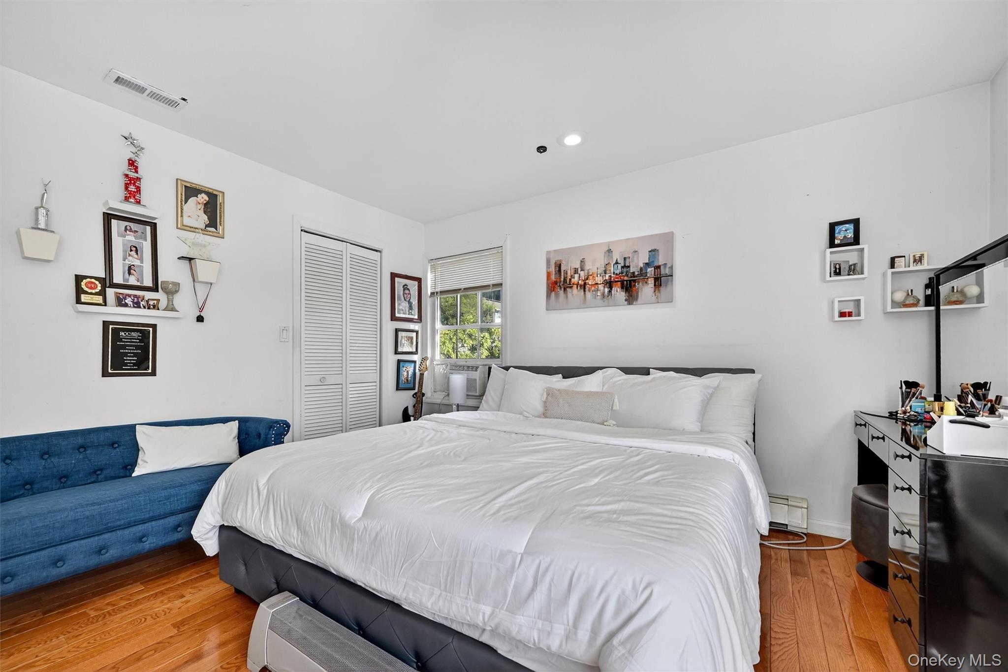 14 Malone Avenue Garnerville, NY 10923 - Photo 33 of 50 a bedroom with a bed and a book shelf