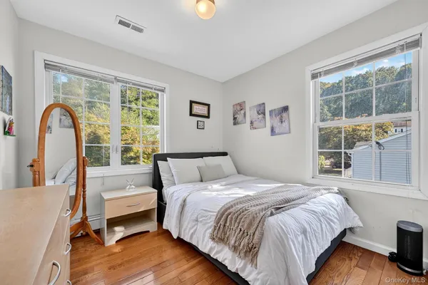 a bed room with a bed and a chair