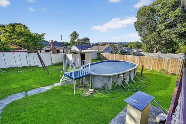 a view of a balcony with furniture