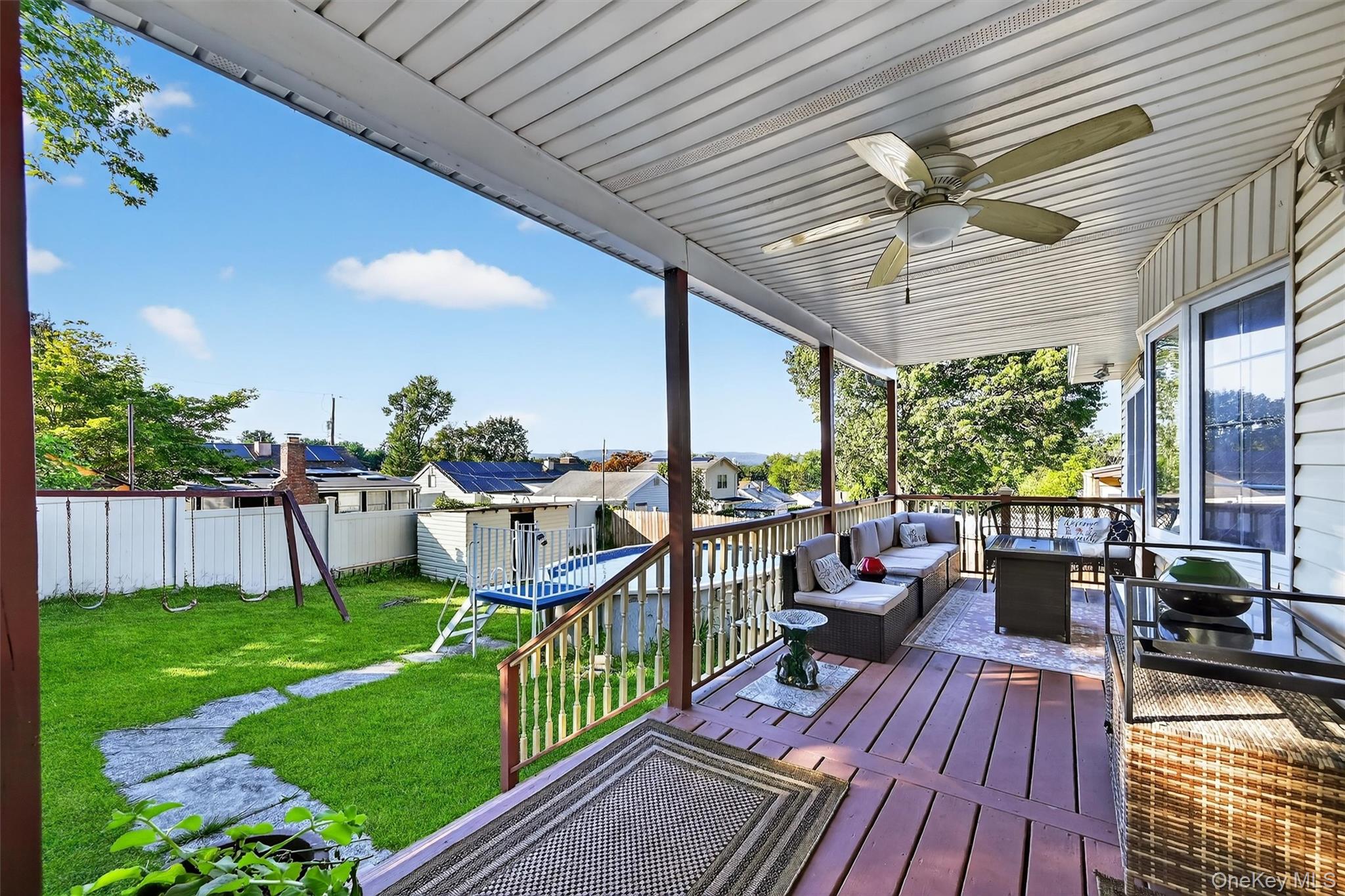 14 Malone Avenue Garnerville, NY 10923 - Photo 42 of 50 a view of a deck with couches table and chairs and potted plants