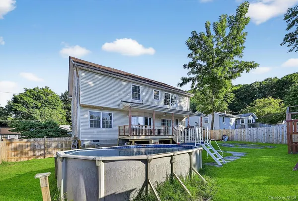 a view of a house with a yard porch and sitting area