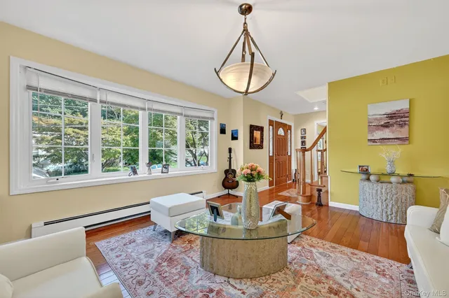 a living room with furniture a window and a table