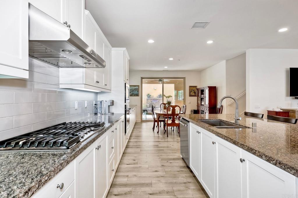 665 Gemstone Drive San Marcos, CA 92078 - Photo 11 of 49 a kitchen with sink stove and cabinets