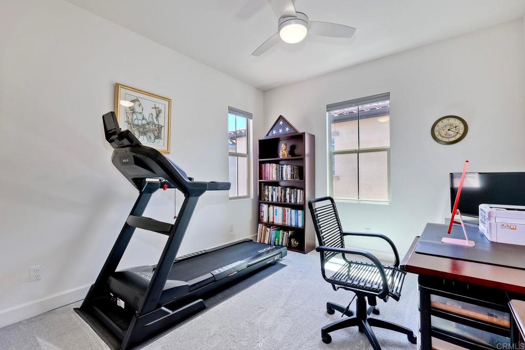 665 Gemstone Drive San Marcos, CA 92078 - Photo 20 of 49 a view of a workspace with furniture and a window