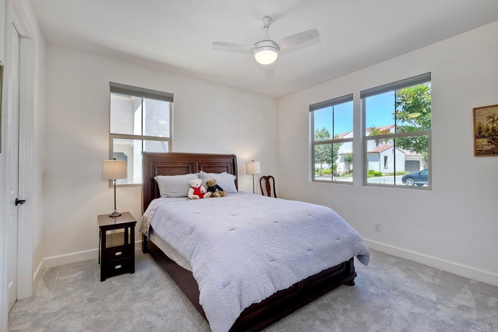 665 Gemstone Drive San Marcos, CA 92078 - Photo 26 of 49 a bedroom with a bed and a window