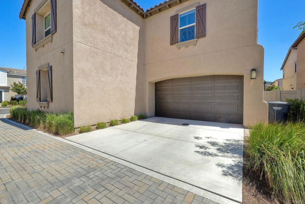 665 Gemstone Drive San Marcos, CA 92078 - Photo 33 of 49 a front view of a house with a yard