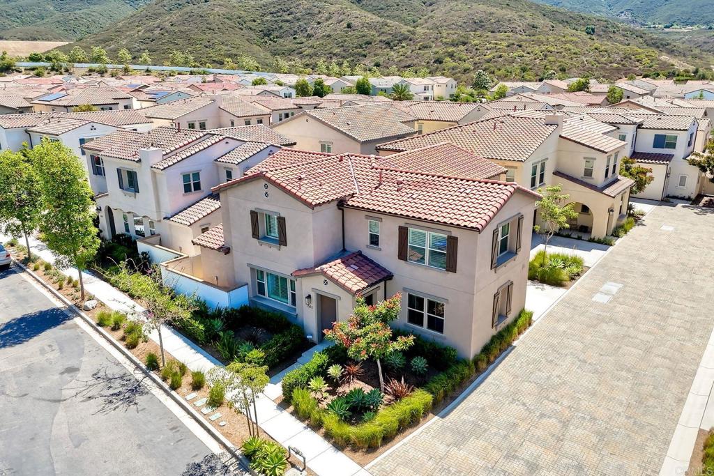 665 Gemstone Drive San Marcos, CA 92078 - Photo 34 of 49 an aerial view of multiple houses with a yard