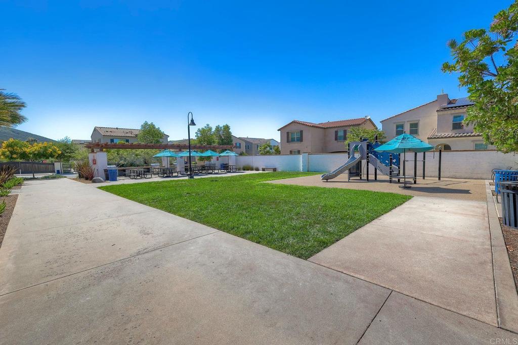 665 Gemstone Drive San Marcos, CA 92078 - Photo 38 of 49 a view of a back yard of the house