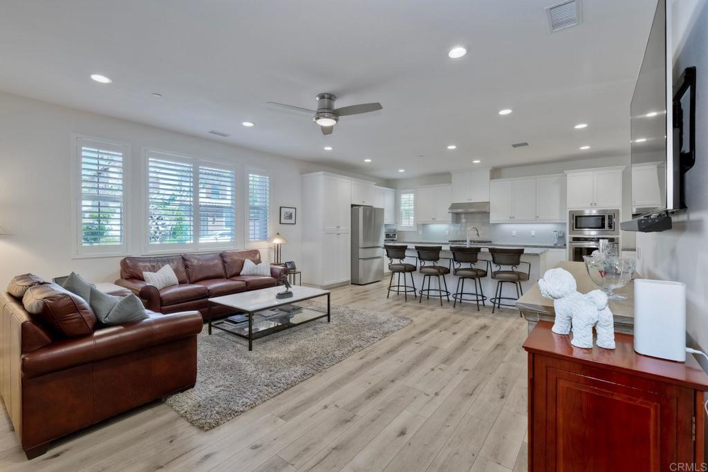 665 Gemstone Drive San Marcos, CA 92078 - Photo 4 of 49 a living room with furniture and kitchen view