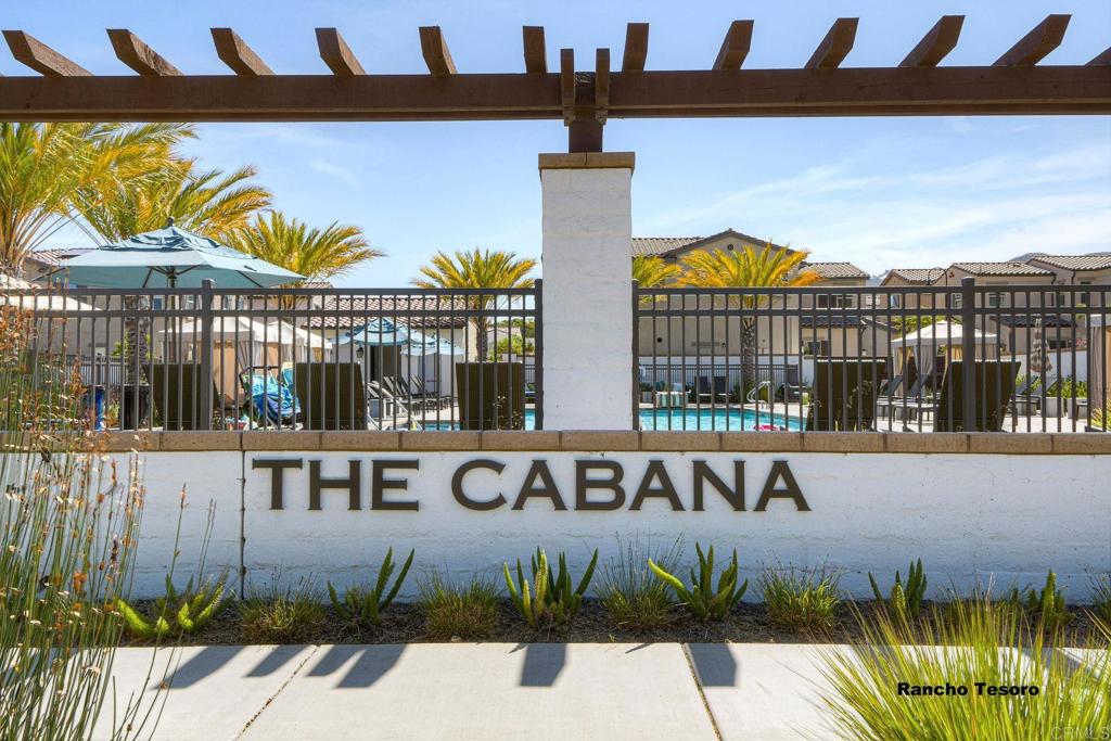 665 Gemstone Drive San Marcos, CA 92078 - Photo 42 of 49 a view of a street sign under an umbrella