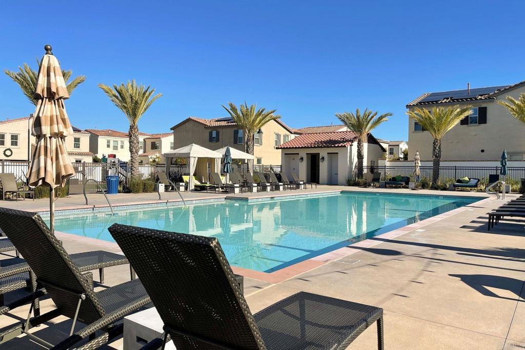 665 Gemstone Drive San Marcos, CA 92078 - Photo 45 of 49 a view of a house with a swimming pool and a sitting area