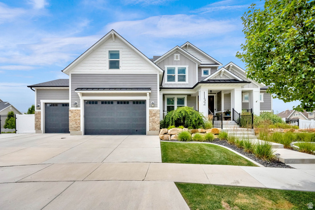 1132 South 1300th Street West Mapleton, UT 84664 - Photo 1 of 52 Modern Craftsman-style residence featuring a prominent gabled roofline, mixed exterior siding, and stone accents