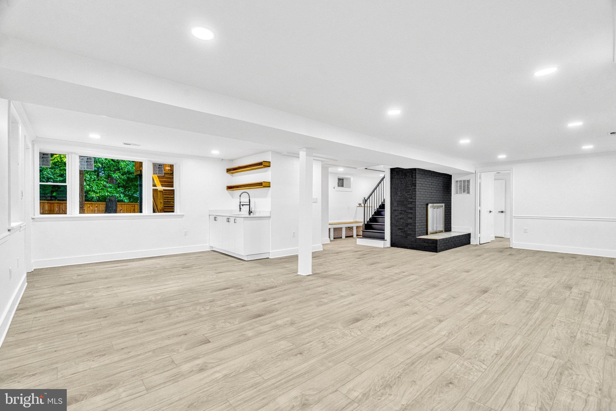 2539 Gallows Road Dunn Loring, VA 22027 - Photo 36 of 56 Lower Family room w/ wet bar and fireplace