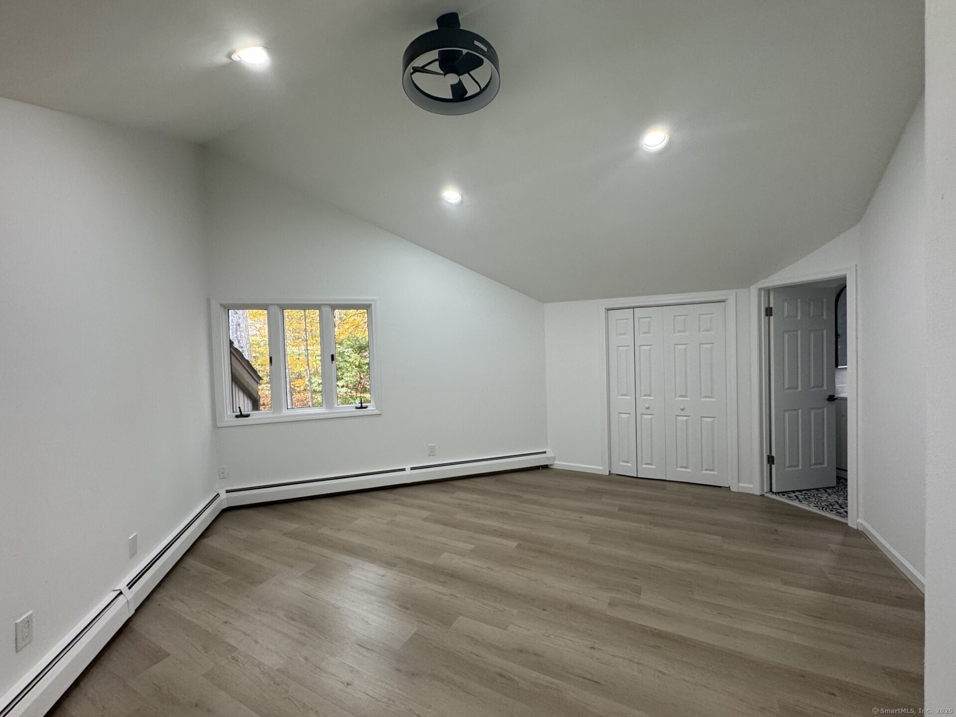 4 Earls Court, Unit C Farmington, CT 06032 - Photo 13 of 18 an empty room with a empty space and windows