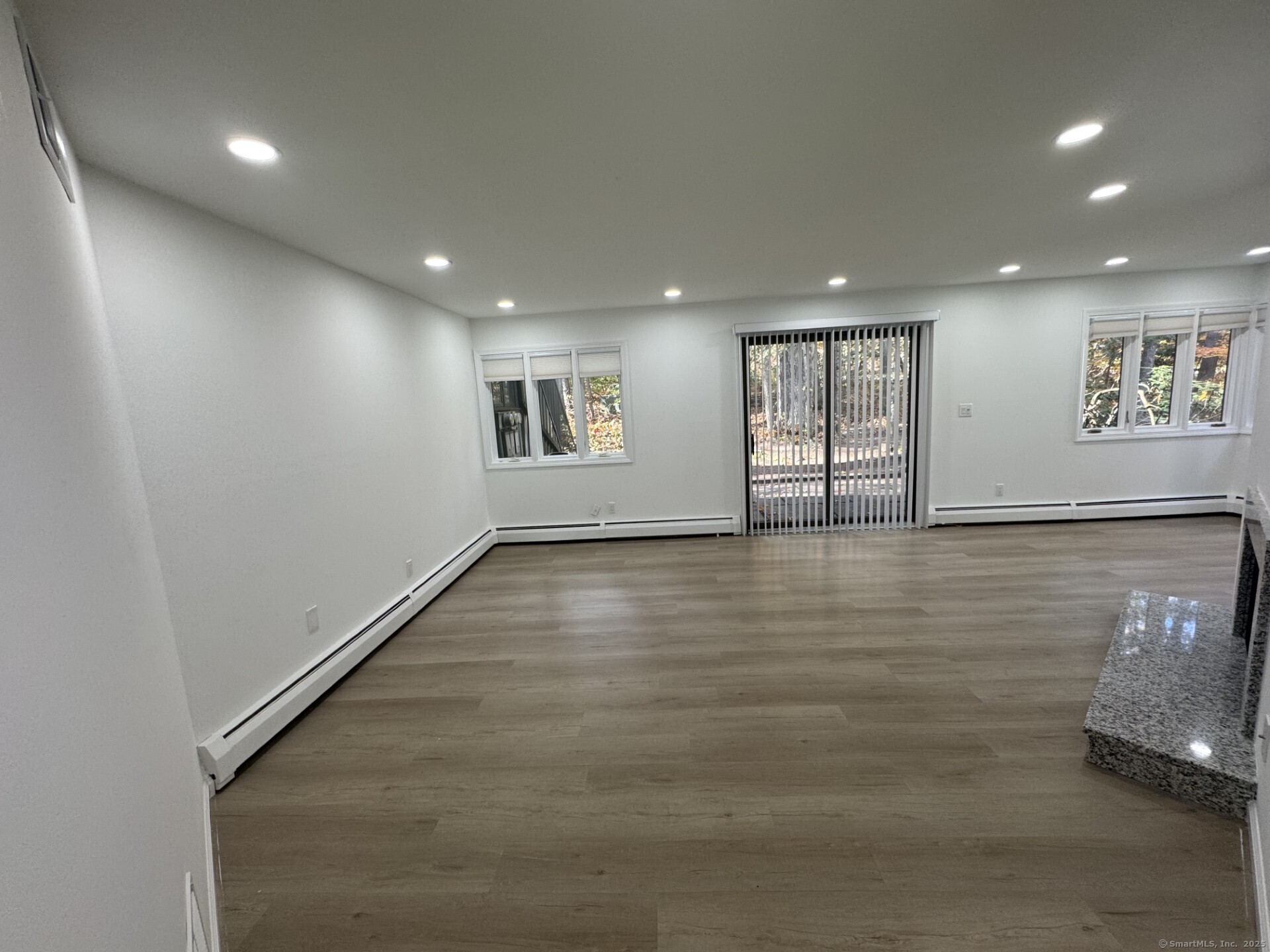 4 Earls Court, Unit C Farmington, CT 06032 - Photo 4 of 18 a view of an empty room with a window