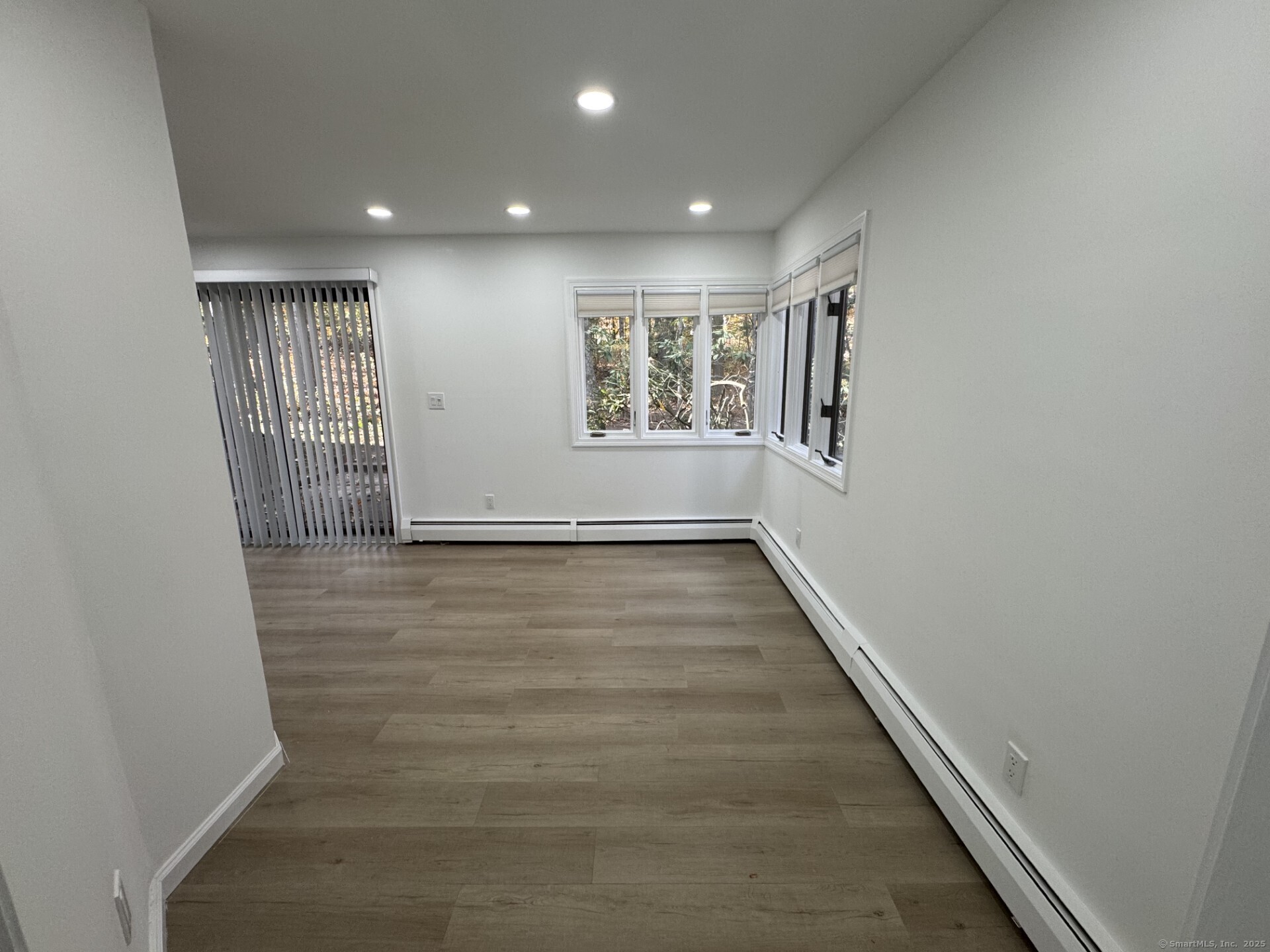 4 Earls Court, Unit C Farmington, CT 06032 - Photo 8 of 18 wooden floor in an empty room with a window