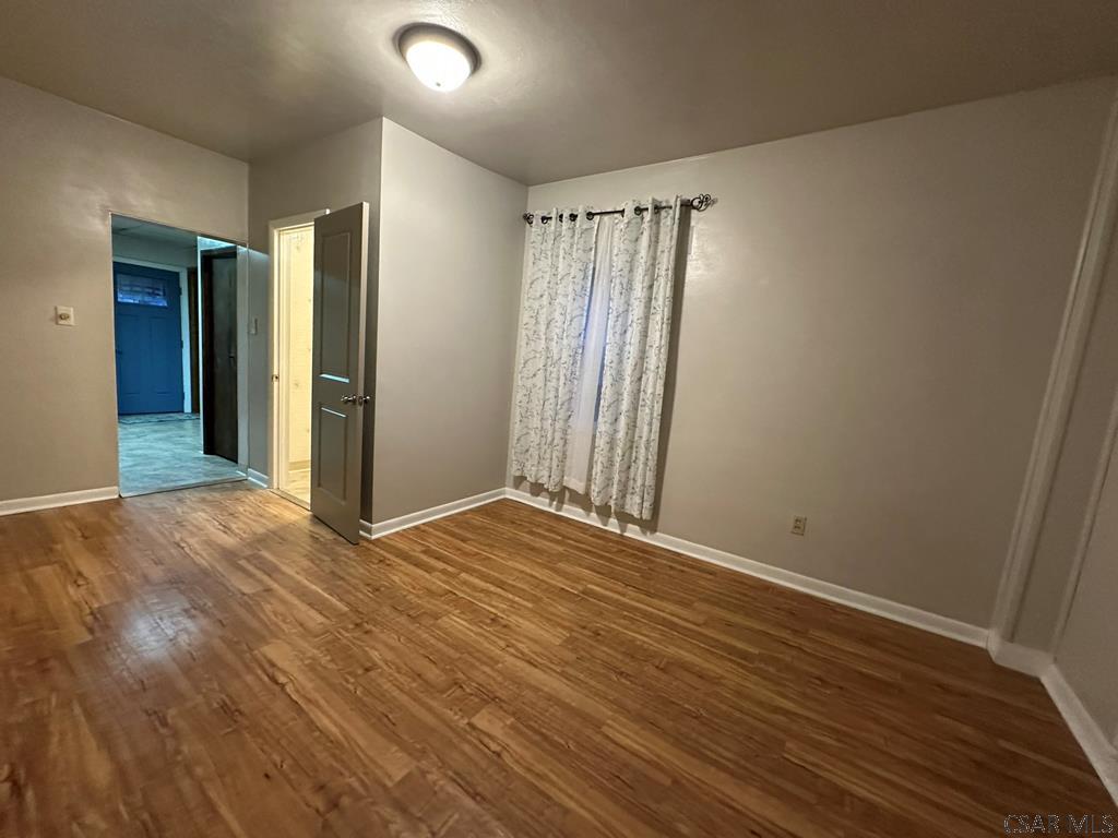 312 12th Street Windber, PA 15963 - Photo 7 of 24 a view of an empty room with wooden floor and a window