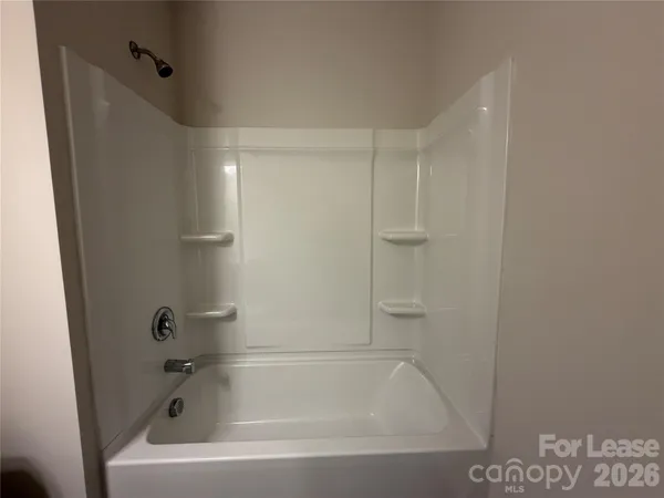 a close view of a bathtub in bathroom