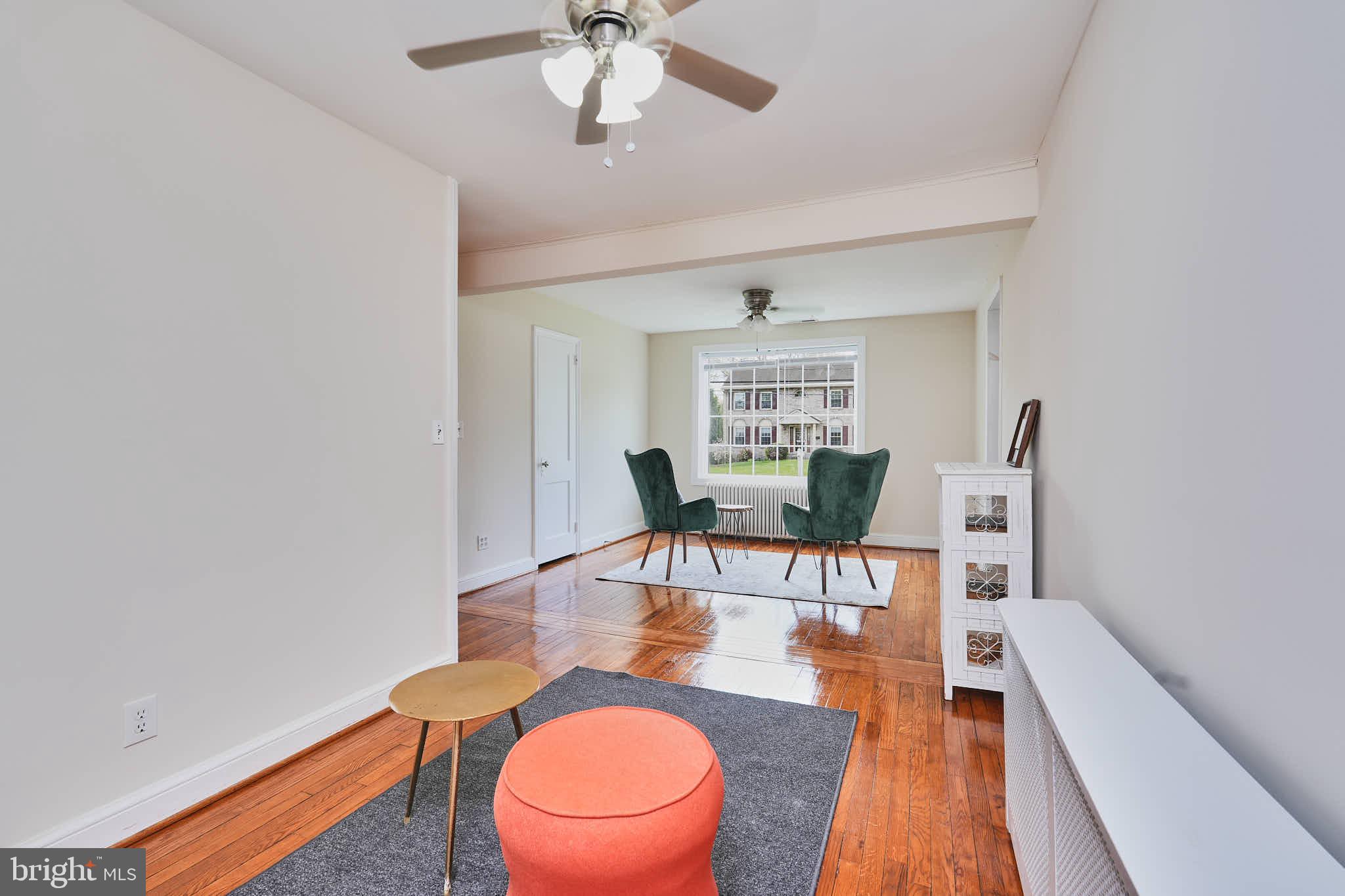 3318 Memorial Street Alexandria, VA 22306 - Photo 13 of 49 a dining room with furniture a rug and wooden floor